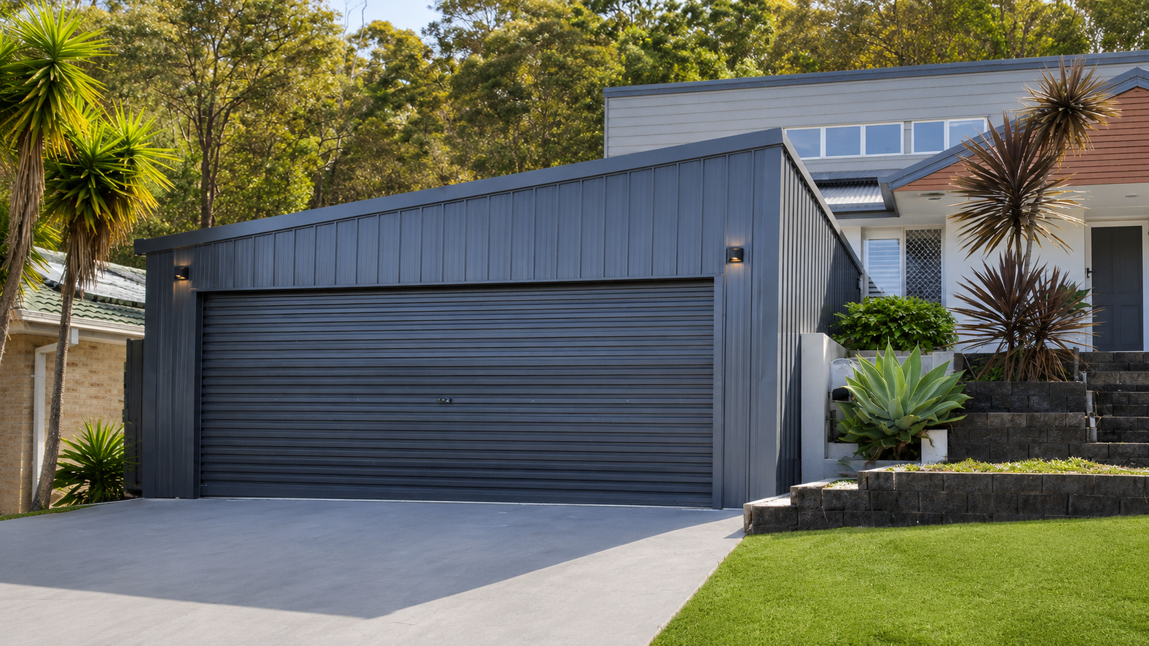 Garage with landscaped driveway